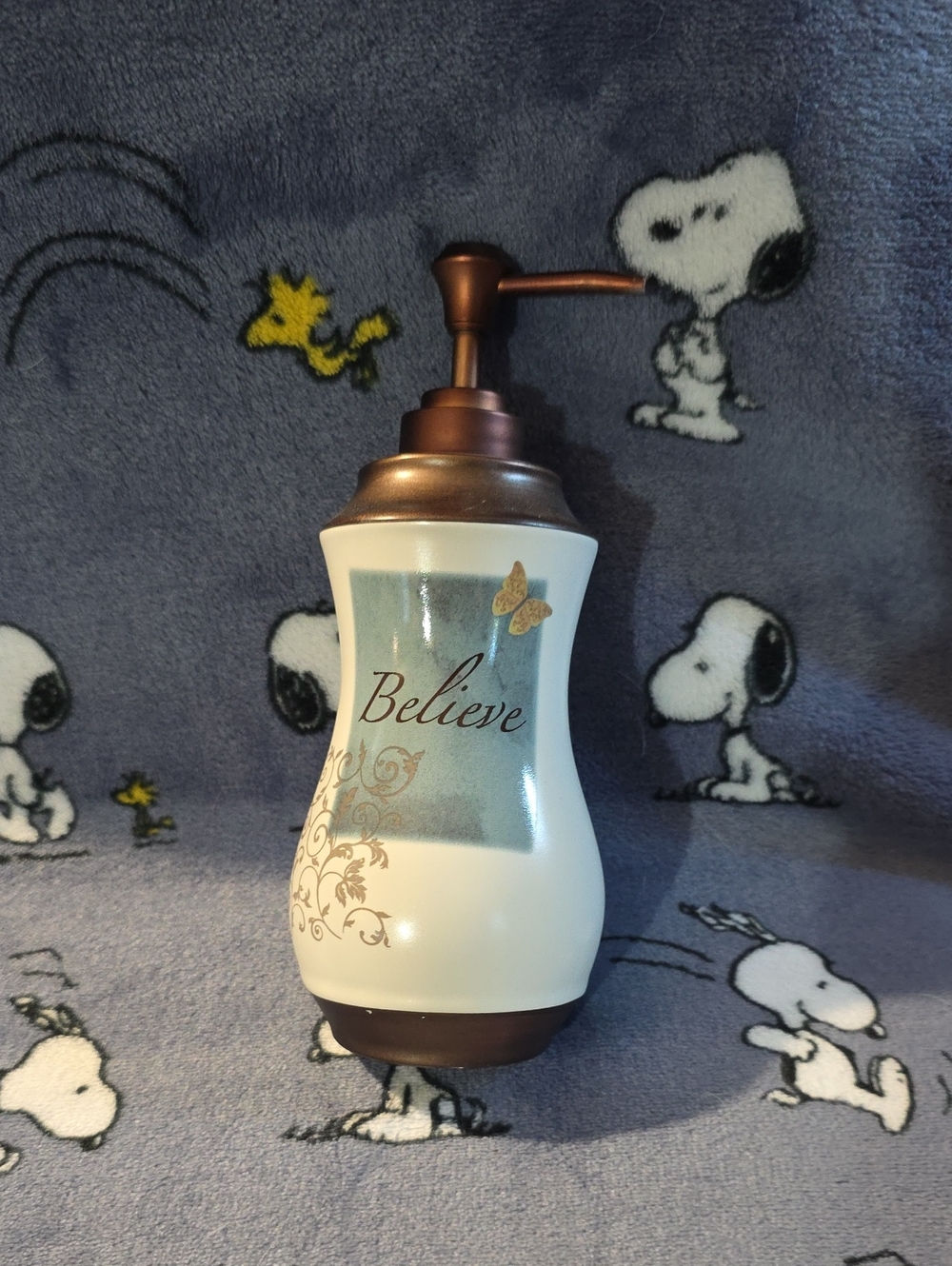 Believe Ceramic Soap Dispenser in White and Bronze
